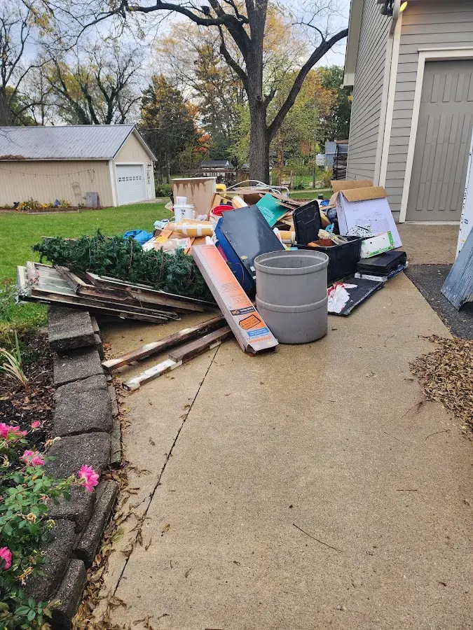 Dumpster being loaded with debris for Roofing Dumpster Rental in Crestview